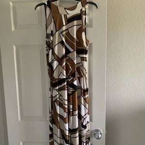 Never worn, sleeveless jumper with belt.